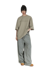 Masonprince Basic Logo Tee in Beige with a relaxed fit, paired with loose-fitting denim jeans