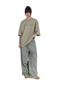 Masonprince Basic Logo Tee in Beige with a relaxed fit, paired with loose-fitting denim jeans