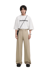 Masonprince Basic Logo Tee in White, styled with relaxed trousers for a trendy outfit