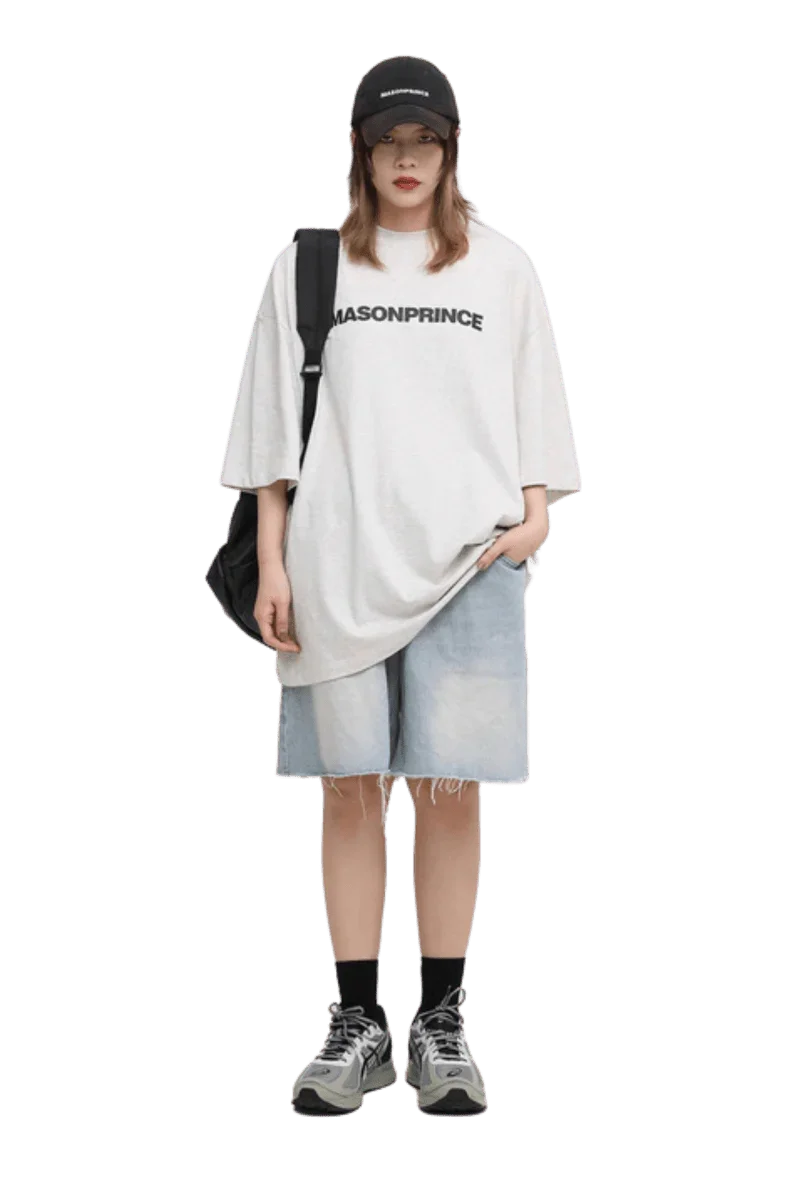 Masonprince Basic Logo Tee in White, styled casually with denim shorts and a cap for a trendy look