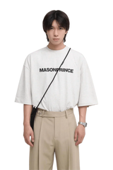 Masonprince Basic Logo Tee in light gray featuring bold black lettering, styled for casual wear