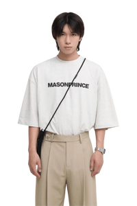 Masonprince Basic Logo Tee in light gray featuring bold black lettering, styled for casual wear