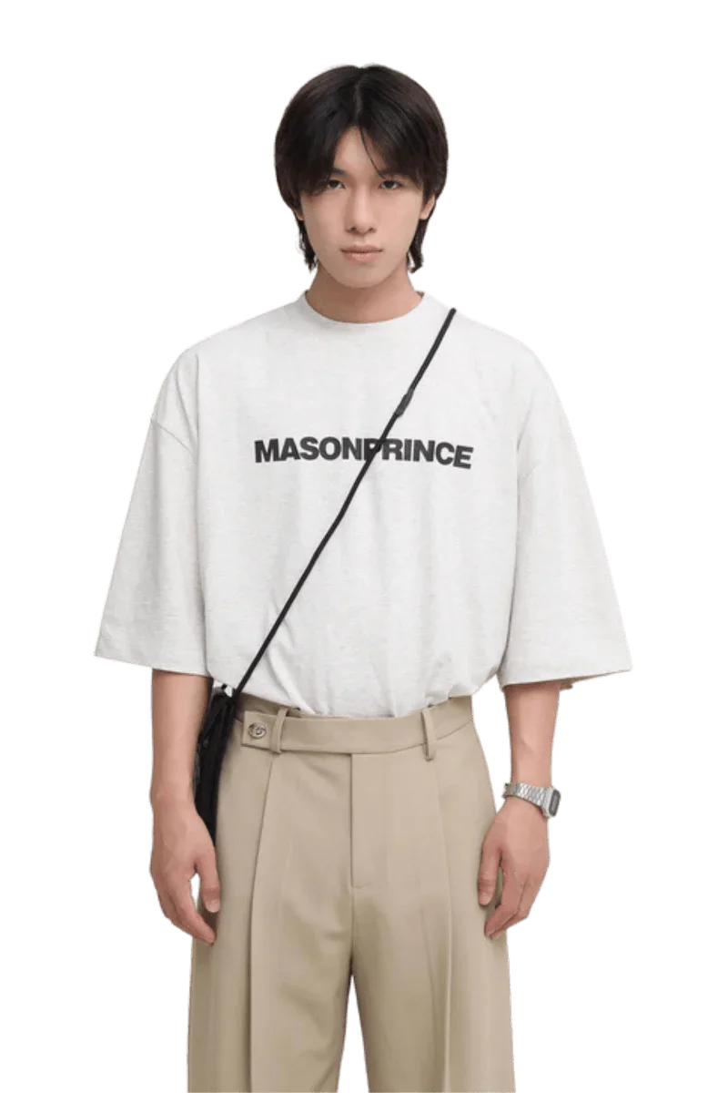 Masonprince Basic Logo Tee in light gray featuring bold black lettering, styled for casual wear