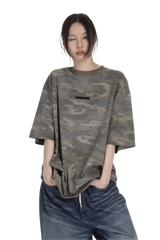 Masonprince camouflage tee worn by model with loose fit and short sleeves paired with blue jeans