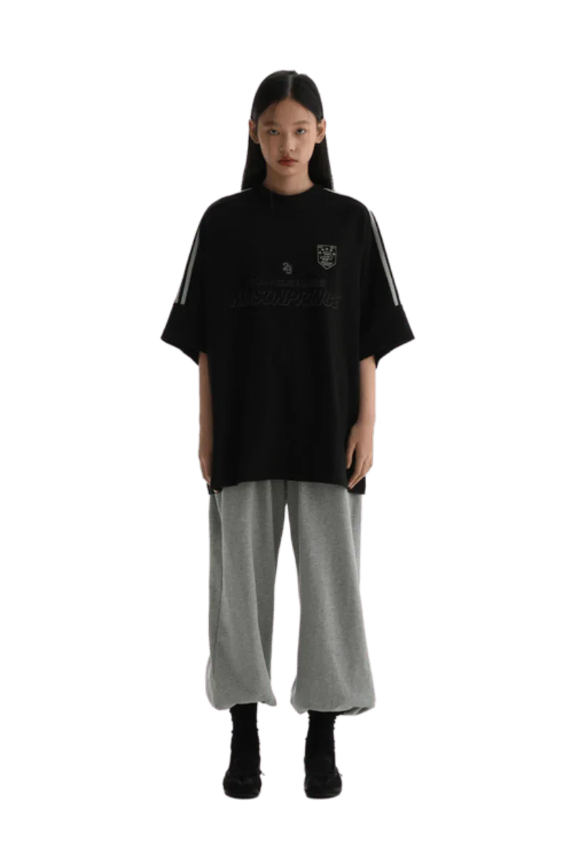 Masonprince Champion League Tee in black with bold logo and relaxed fit for casual street style
