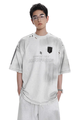 Masonprince Champion League Tee white oversized distressed t-shirt with black emblem worn by model