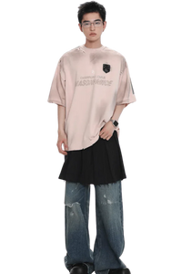 Model wearing Masonprince Champion League Tee in light pink with black patch and casual oversized fit