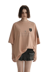 Masonprince Champion League Tee in soft peach with logo detail and relaxed fit for casual wear