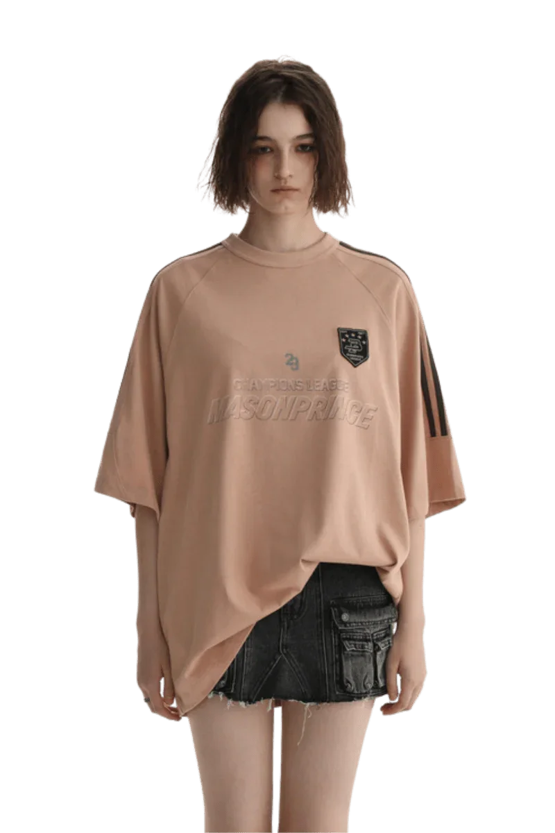Masonprince Champion League Tee in soft peach with logo detail and relaxed fit for casual wear