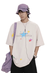 Masonprince colorful star tee worn by male model with purple bucket hat and bag