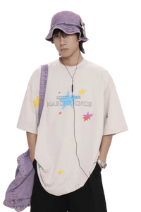 Masonprince colorful star tee worn by male model with purple bucket hat and bag