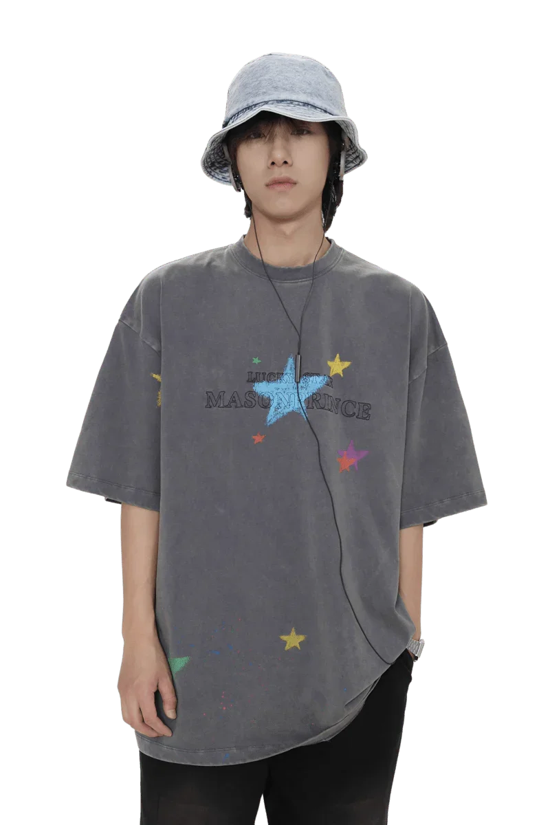 Masonprince colorful star tee in faded black worn by model with blue bucket hat