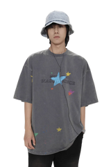 Masonprince colorful star tee in faded black worn by model with blue bucket hat