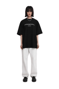 Masonprince Faded Logo Tee in black with casual oversized fit, paired with white pants