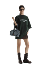 Masonprince Faded Logo Tee in Dark Green, styled with a mini skirt and combat boots