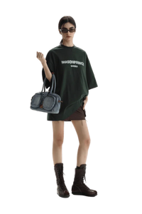 Masonprince Faded Logo Tee in Dark Green, styled with a mini skirt and combat boots