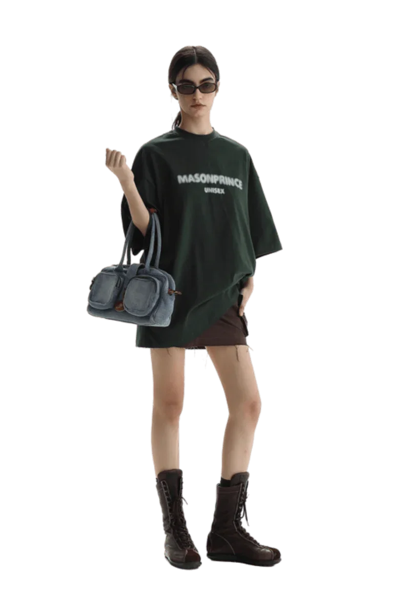 Masonprince Faded Logo Tee in Dark Green, styled with a mini skirt and combat boots