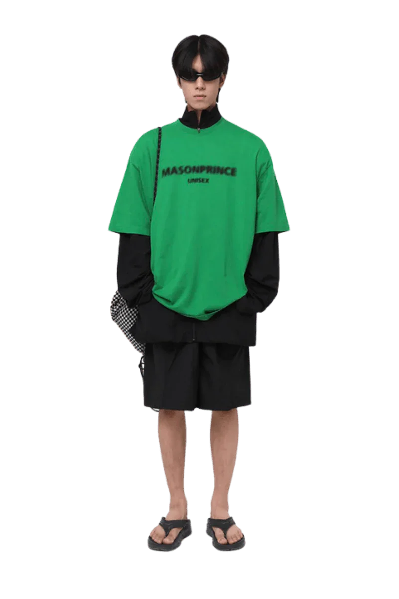 Model wearing Masonprince Faded Logo Tee in bright green with layered streetwear style