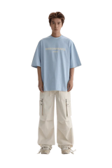 Light blue Masonprince Faded Logo Tee paired with white cargo pants for a trendy casual look