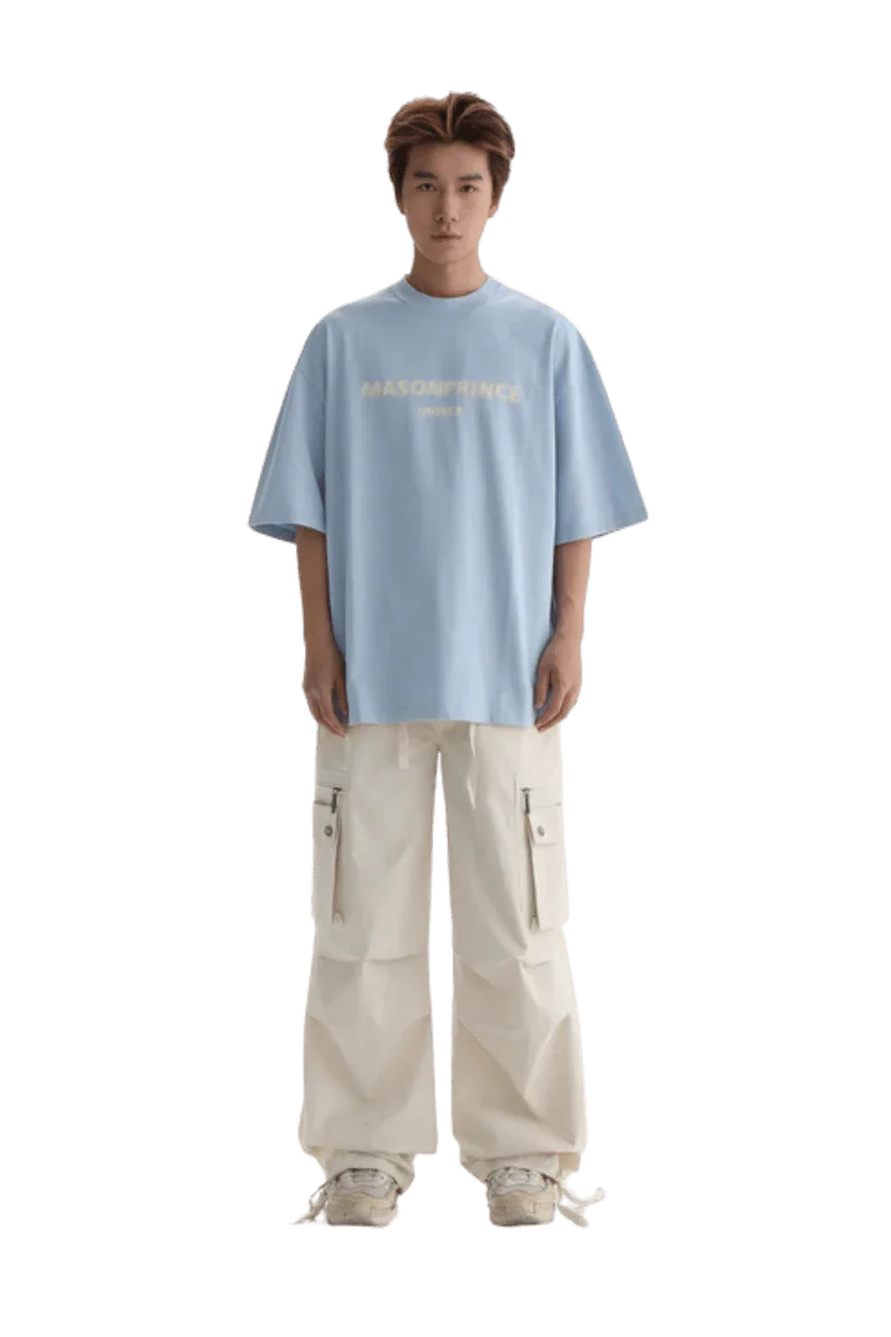Light blue Masonprince Faded Logo Tee paired with white cargo pants for a trendy casual look