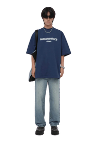 Stylish Masonprince Faded Logo Tee in navy blue, paired with relaxed denim jeans for a trendy look