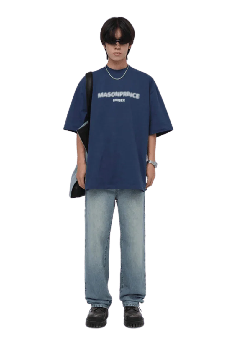 Stylish Masonprince Faded Logo Tee in navy blue, paired with relaxed denim jeans for a trendy look