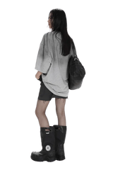 Woman wearing Masonprince Gradient Tee gray oversized shirt with black shorts and boots