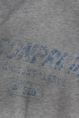 Close-up of gray fabric with faded blue print on Masonprince Gradient Tee clothing