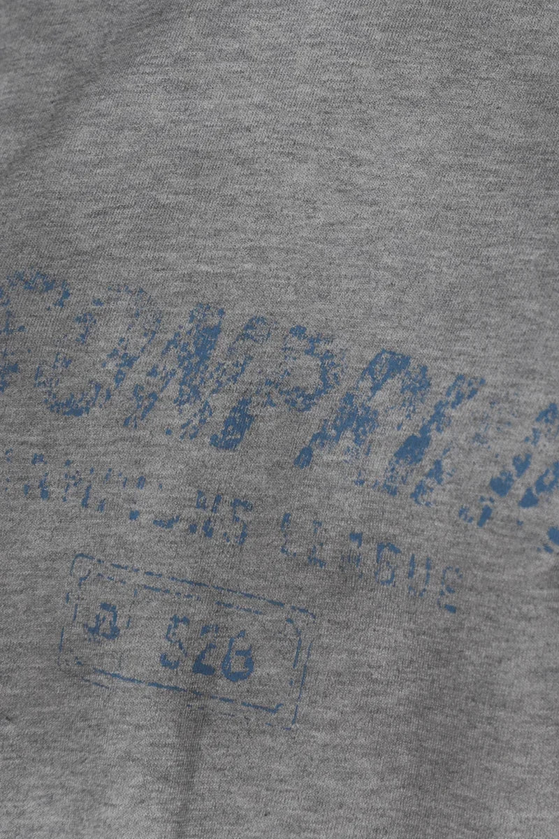 Close-up of gray fabric with faded blue print on Masonprince Gradient Tee clothing