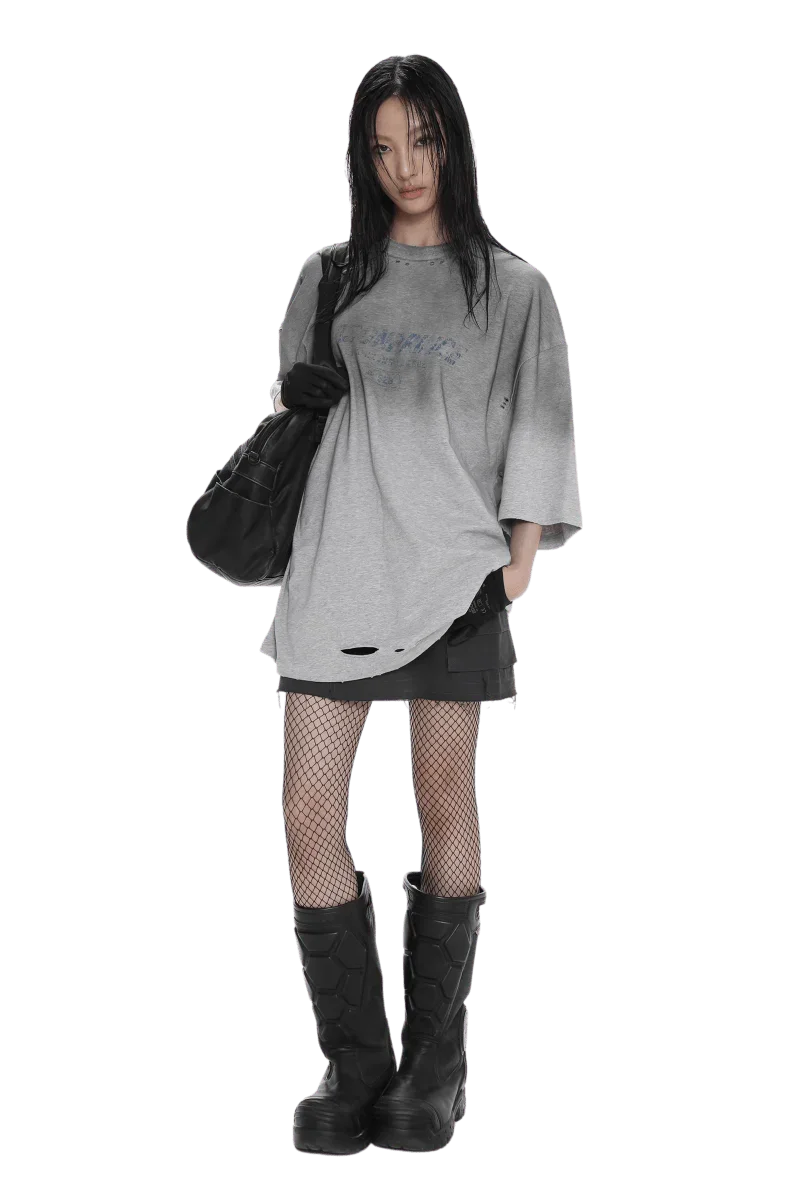 Model wearing Masonprince Gradient Tee oversized gray gradient shirt with distressed details and black accessories