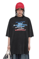 Masonprince black Real World Tee with blue and red graphic text worn with red cap and bag