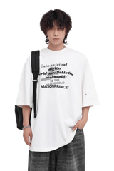 Masonprince Real World Tee white oversized shirt with black text worn by male model with backpack