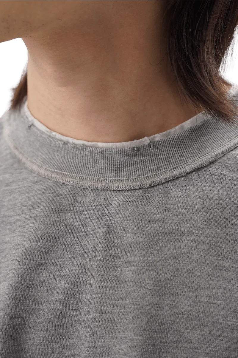 Close-up of Masonprince reversed style tee showing gray fabric and ribbed neckline detail