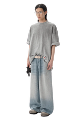 Model wearing Masonprince reversed style tee gray oversized fit with casual wide-leg jeans