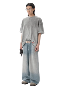 Model wearing Masonprince reversed style tee gray oversized fit with casual wide-leg jeans