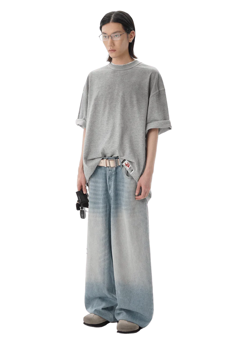 Model wearing Masonprince reversed style tee gray oversized fit with casual wide-leg jeans