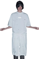 Model wearing a white Masonprince Spokesman tee with matching pants and a black beanie hat