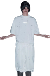 Model wearing a white Masonprince Spokesman tee with matching pants and a black beanie hat