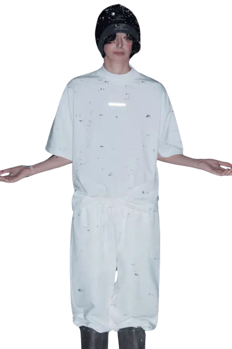 Model wearing a white Masonprince Spokesman tee with matching pants and a black beanie hat