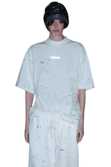Model wearing Masonprince Spokesman tee in white with a relaxed fit and black beanie hat