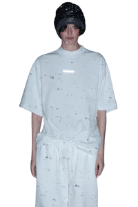 Model wearing Masonprince Spokesman tee in white with a relaxed fit and black beanie hat