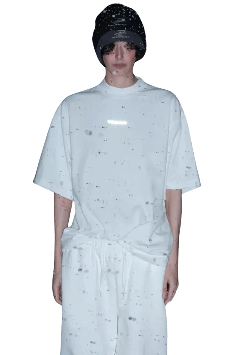 Model wearing Masonprince Spokesman tee in white with a relaxed fit and black beanie hat