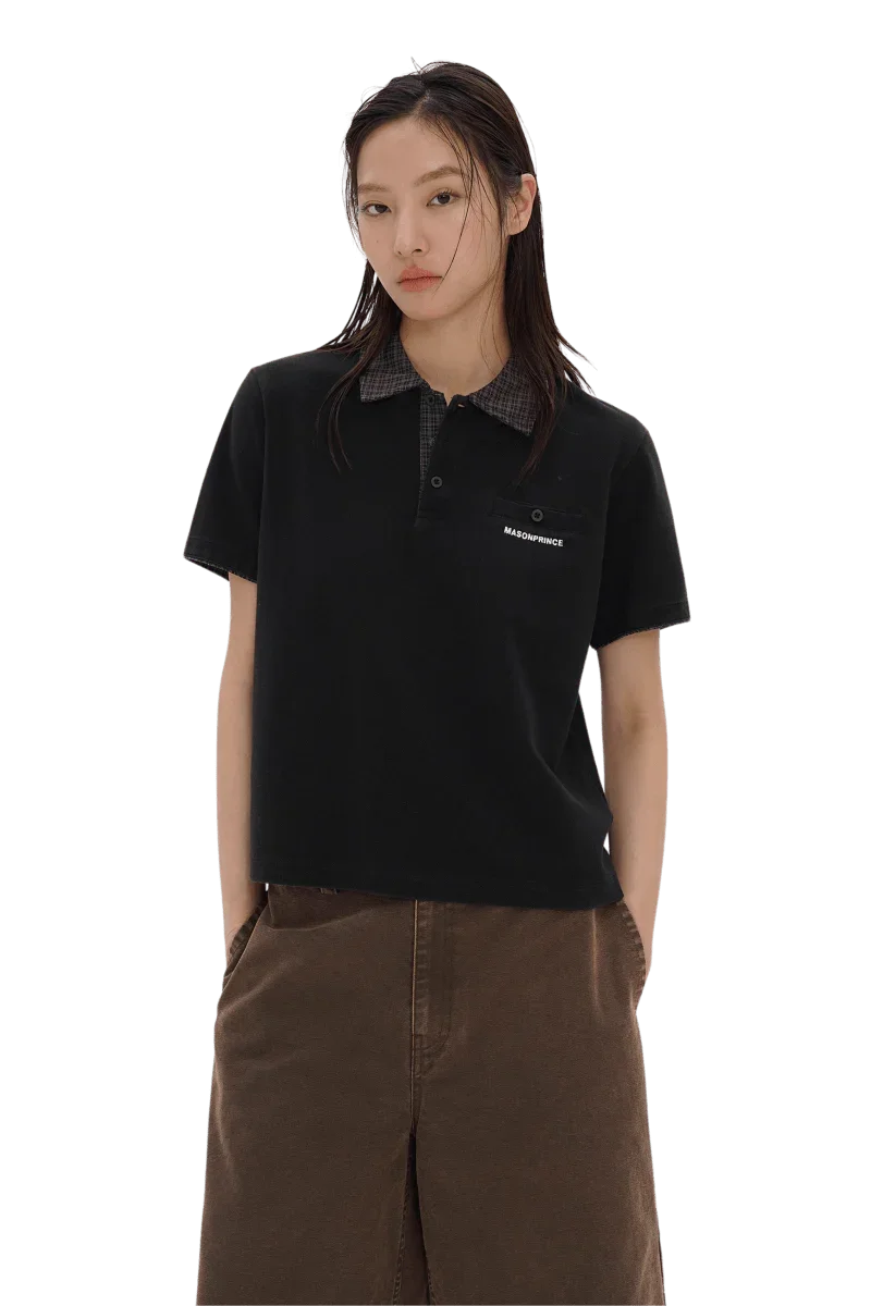 Woman wearing black Masonprince SS25 Polo Tee with checkered collar and brown pants
