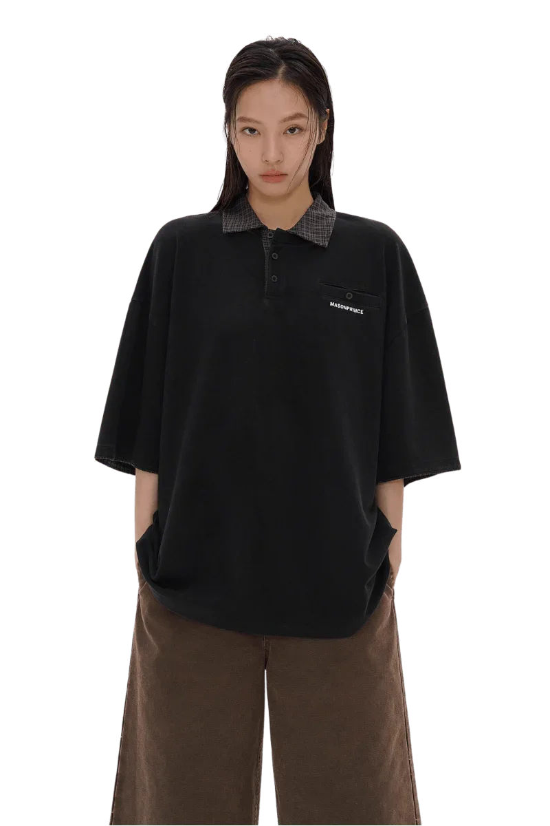 Masonprince SS25 Polo Tee in black with checkered collar worn by model with hands in pockets
