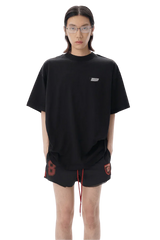 Model wearing black Masonprince SS25 Tape Tee with relaxed fit and small chest logo