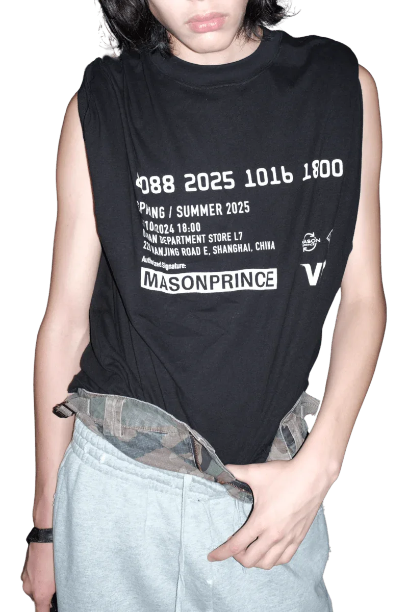 Masonprince SS25 VIP Tee black sleeveless shirt with white printed text worn with gray pants