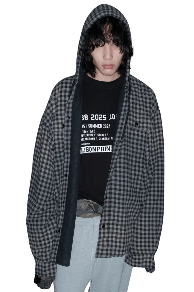 Masonprince SS25 VIP Tee worn under a black and gray checkered hooded shirt with gray pants