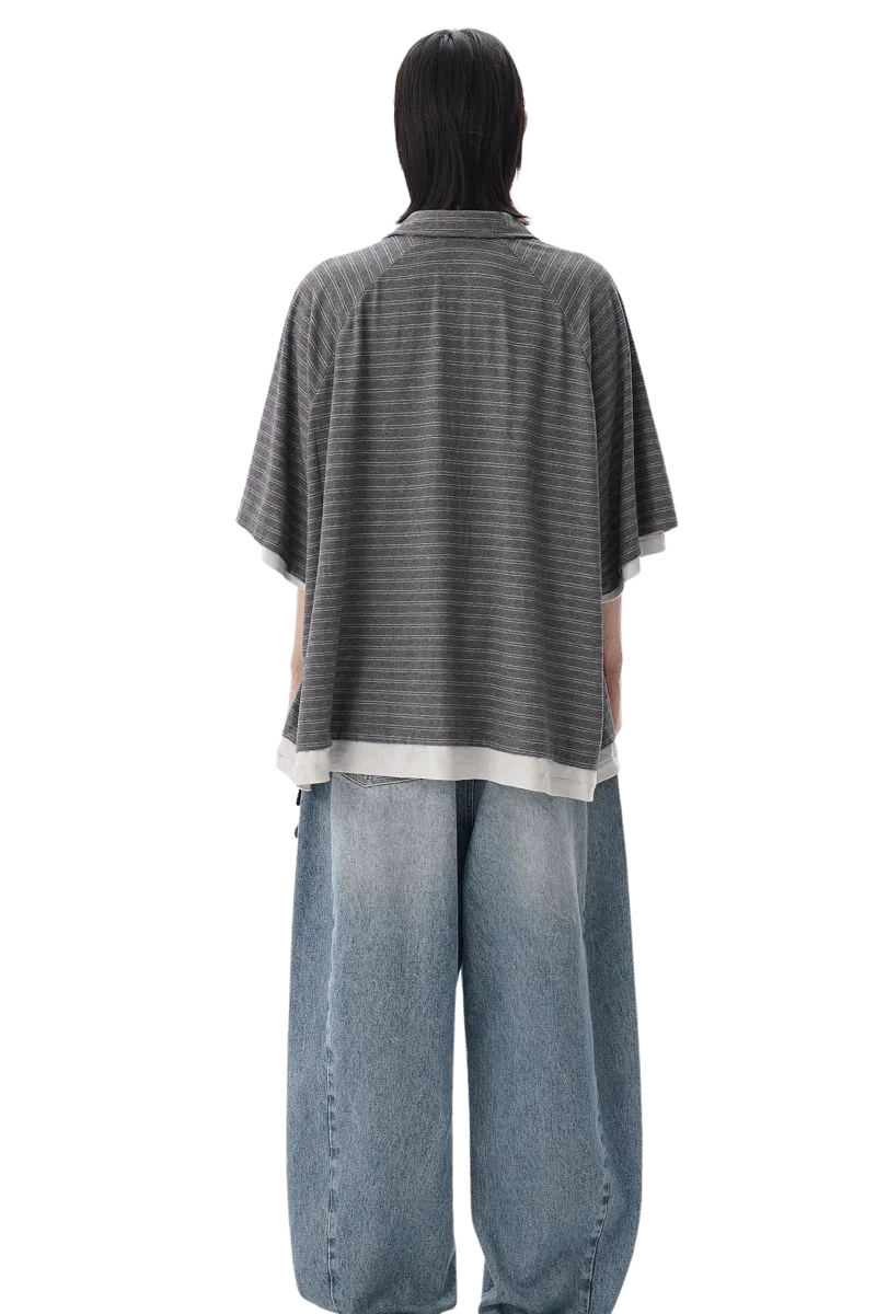 Back view of Masonprince Stripes Polo Tee in gray with horizontal stripes worn with loose blue jeans