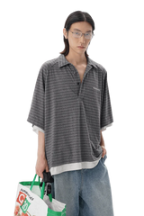 Male model wearing Masonprince Stripes Polo Tee in gray with horizontal stripes and loose fit