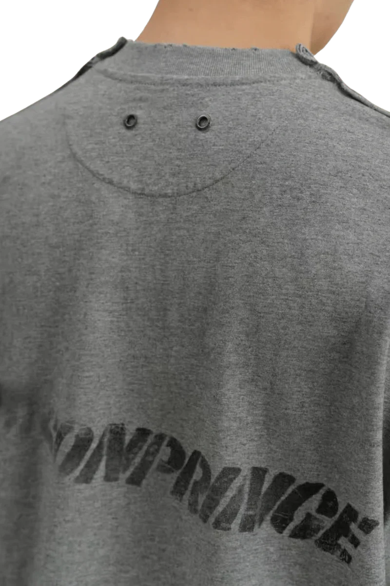 Back view of gray Masonprince Tag Drop Tee with black Masonprince logo and double grommet detail on back